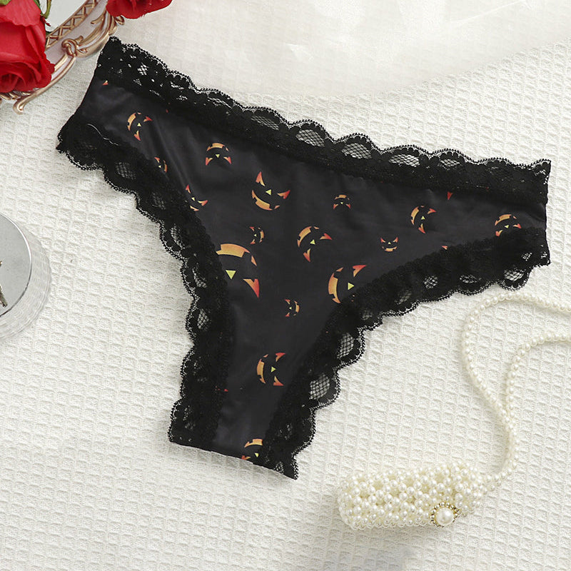 Black lace-trim thong panty with orange Halloween pumpkin print