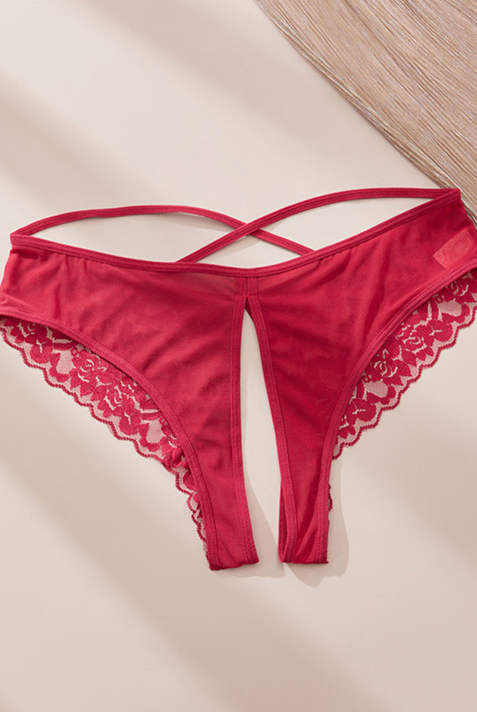 Red satin-like crotchless panties with lace trim and criss-cross strap design