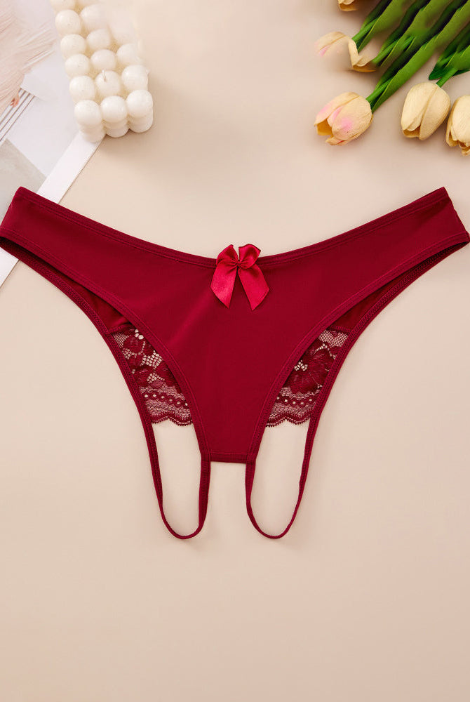 Plus size red crotchless lace thong with lace-trim waistband and center bow