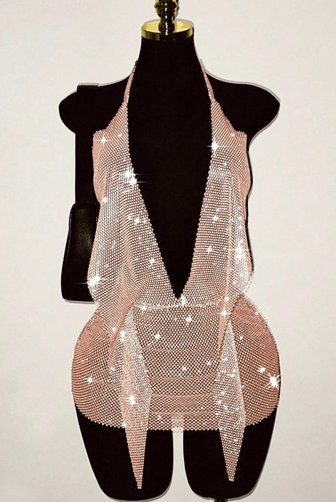 Gold rhinestone fishnet halter mini dress on mannequin with open-back deep V