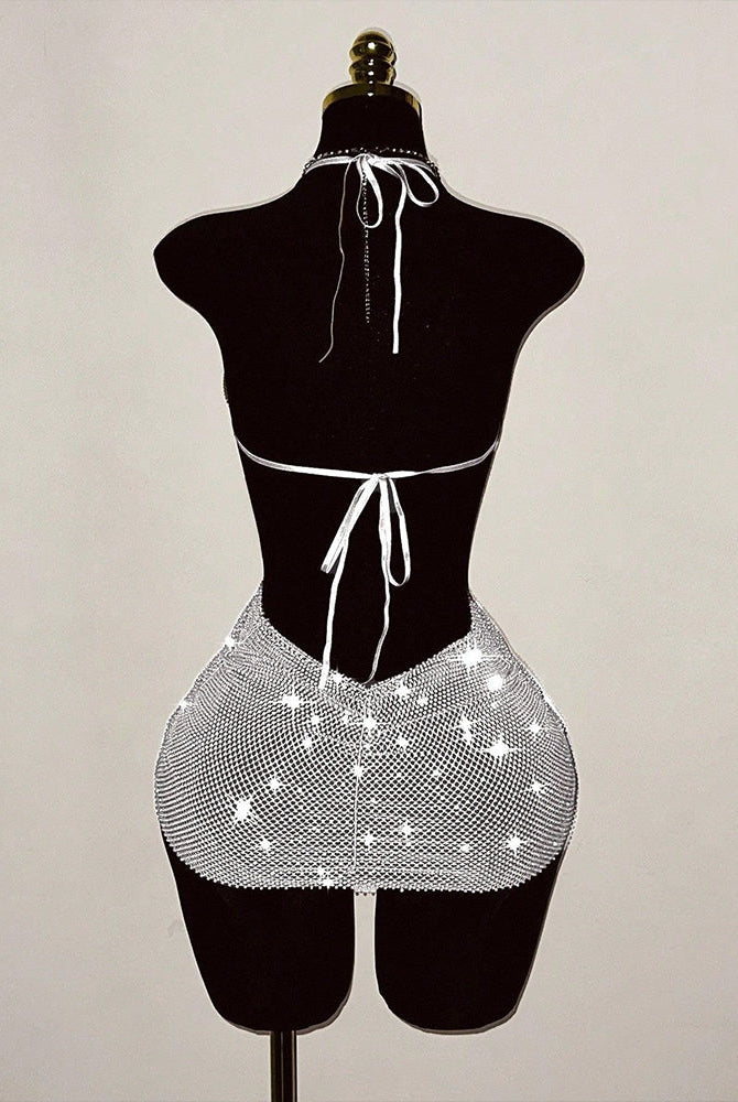 Silver rhinestone fishnet halter mini dress with tie halter and open-back cutout