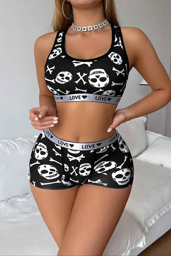 Black skull-print racerback sports bra and boyshorts lounge set, cropped front view