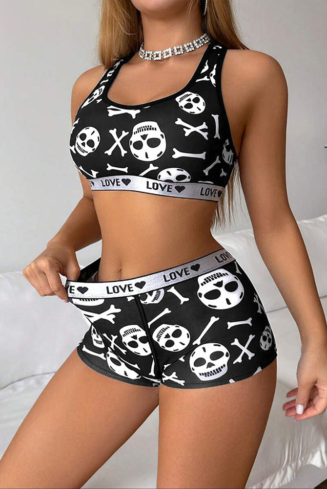 Black skull-print racerback sports bra and boyshorts lounge set, front close-up pose