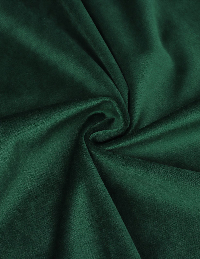 Green velvet fabric close-up with soft sheen and gathered fold detail