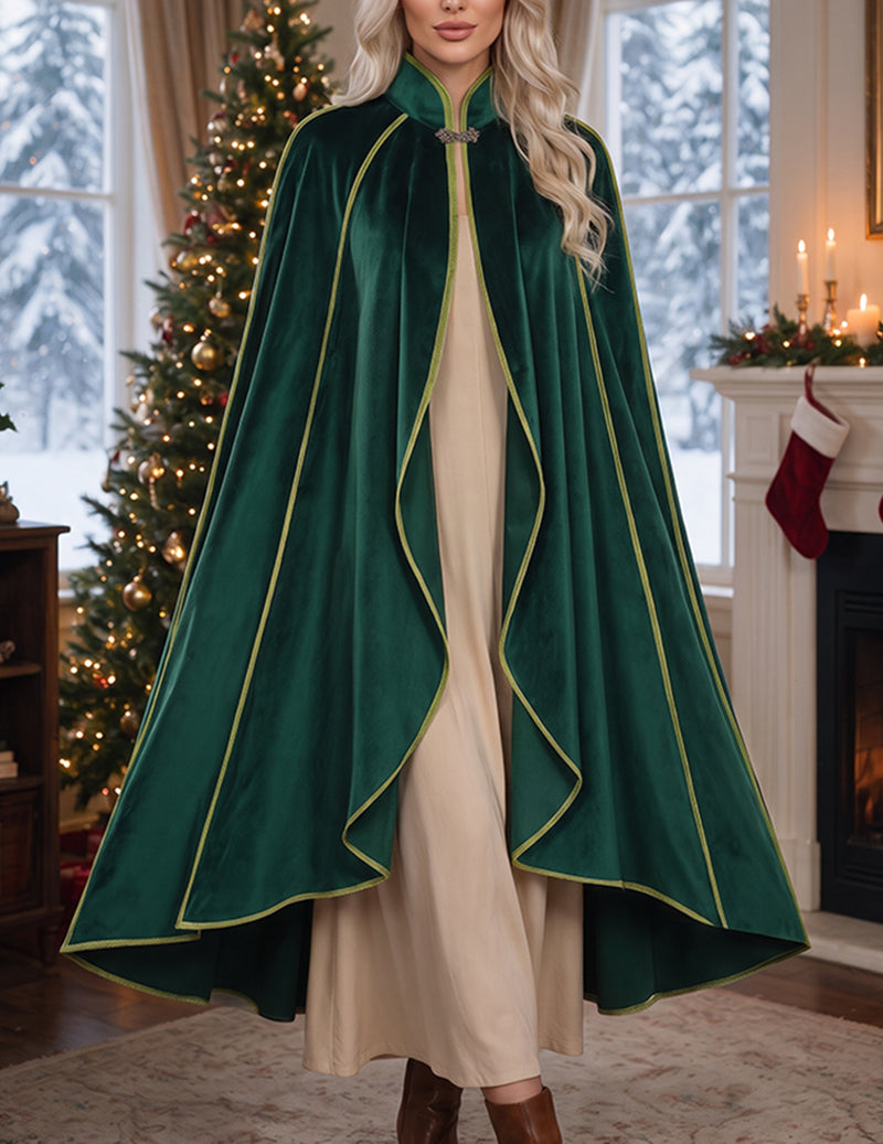 Green velvet cloak cape with gold trim worn over a cream underlayer, buttoned neckline