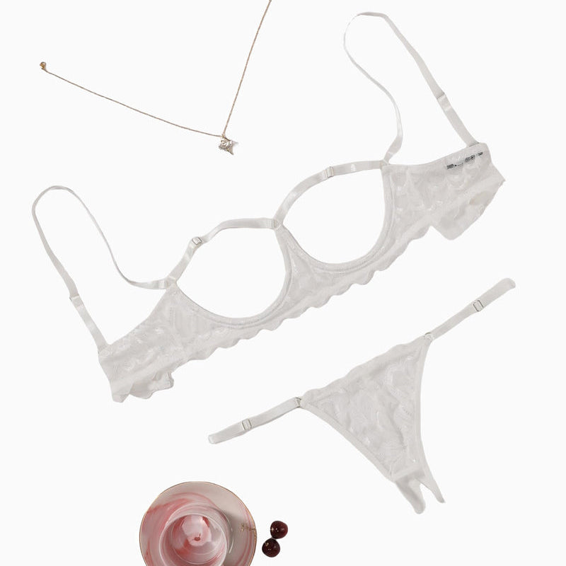 White lace cupless lingerie set with adjustable straps and a matching thong, perfect for women.