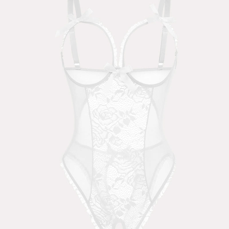 Crotchless white lace bodysuit with cutout bra, floral lace, ruffle trim, and adjustable straps.