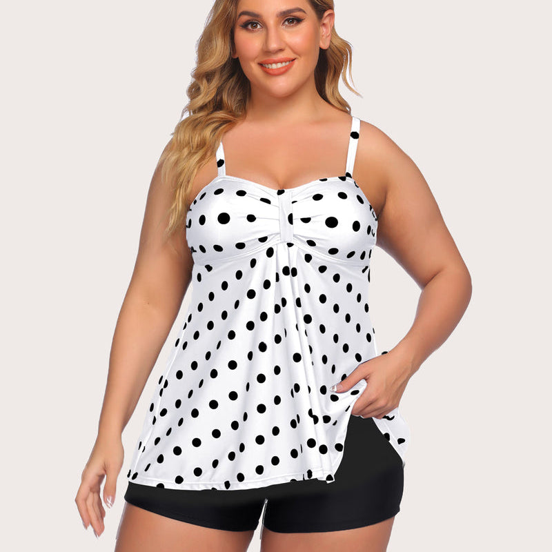 Polka dot tankini swimsuit for women. Adjustable straps and black swim shorts. Stylish swimwear