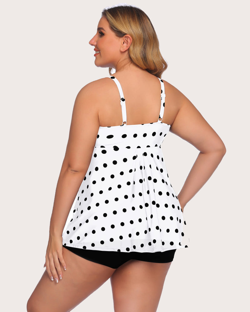 Polka dot tankini swimsuit with adjustable straps and black shorts. Retro swimwear style
