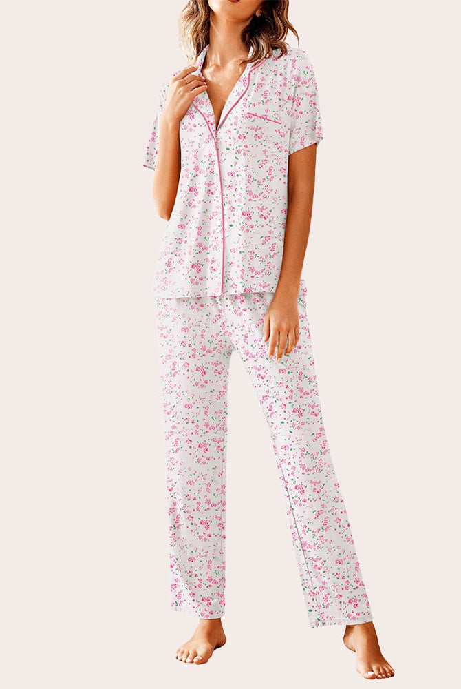 White floral pajama set, button-down shirt and long pants. Comfortable women's sleepwear.