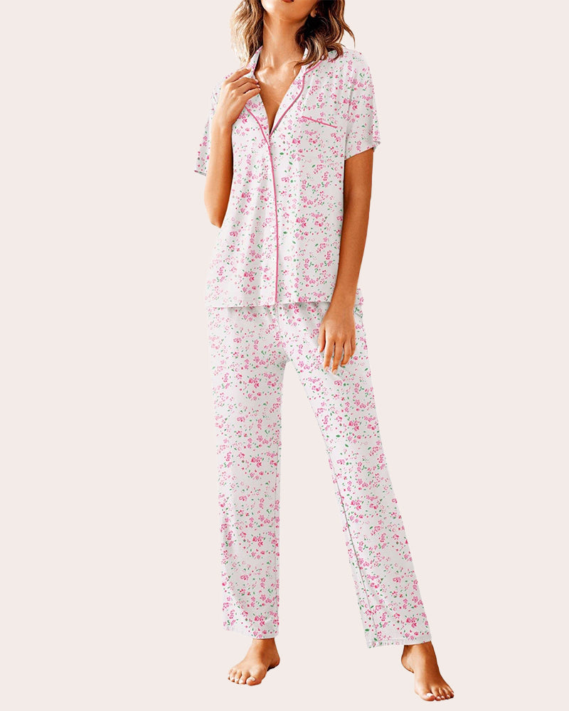 White floral pajama set, button-down shirt and long pants. Comfortable women's sleepwear.