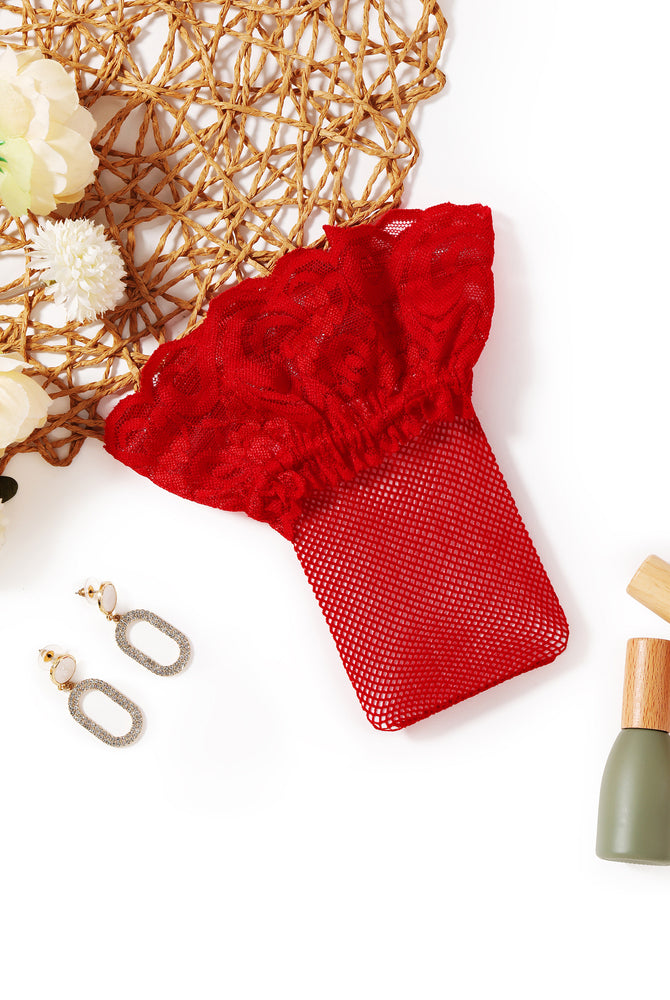 Red fishnet thigh-high stocking with lace trim, perfect for adding a touch of sexy to any look