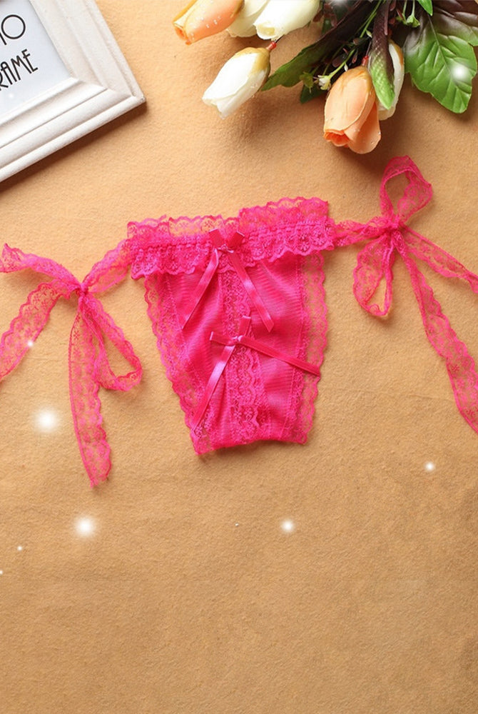 Pink lace crotchless thong panty with adjustable ties and ribbon details, sensual lingerie