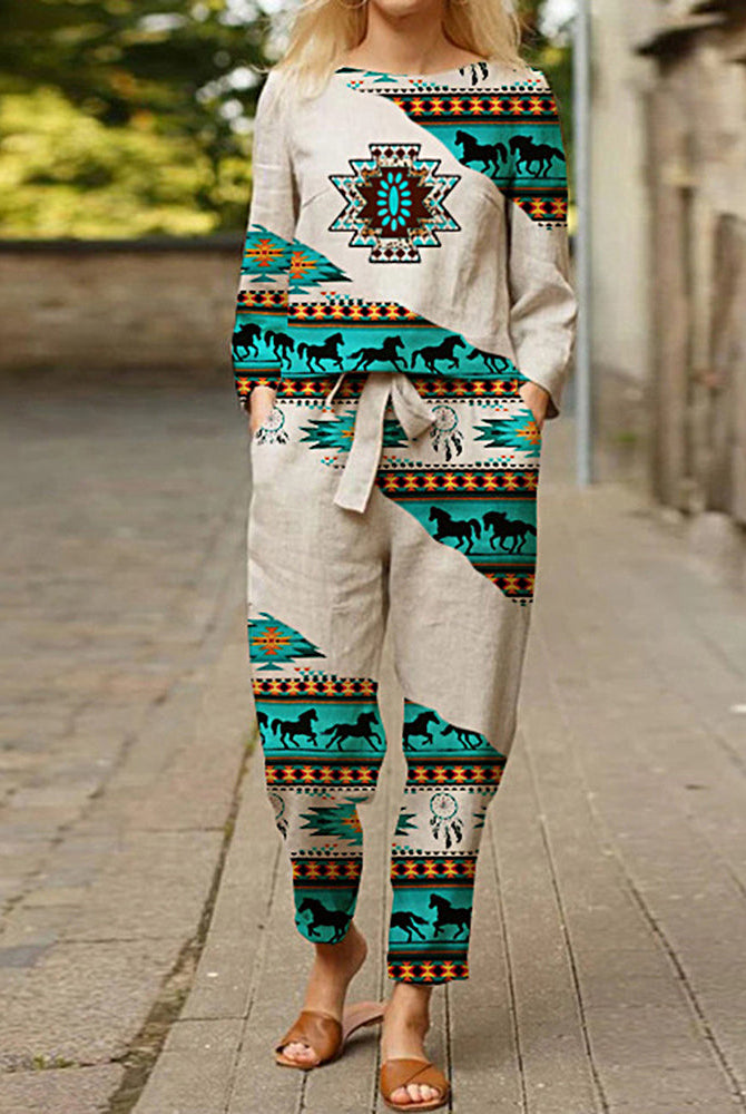Beige linen two-piece print tracksuit with horse and geometric patterns. Casual style.