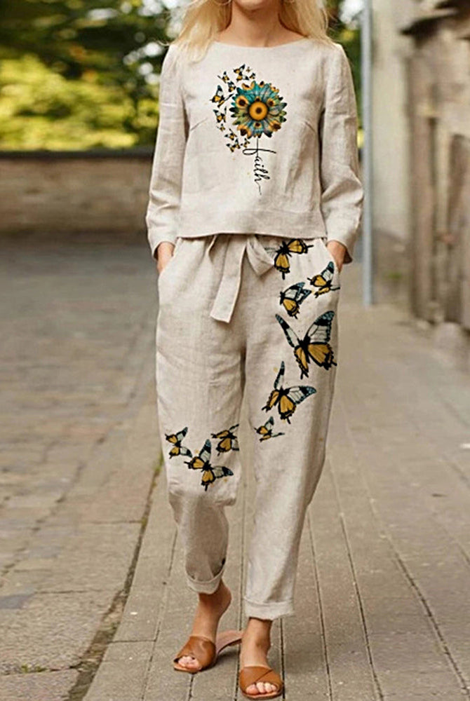 Print tracksuit: beige linen top with sunflower, "Faith" text, and butterfly print pants.