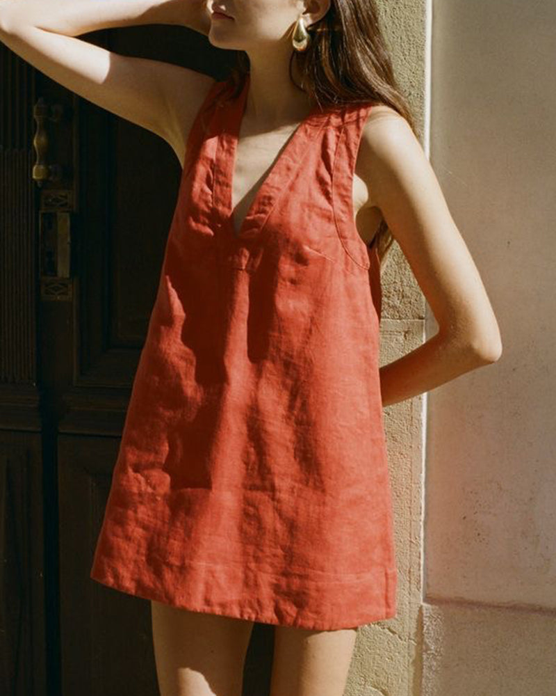 Sleeveless loose mini dress in red-orange linen-cotton blend, perfect for vacation wear.