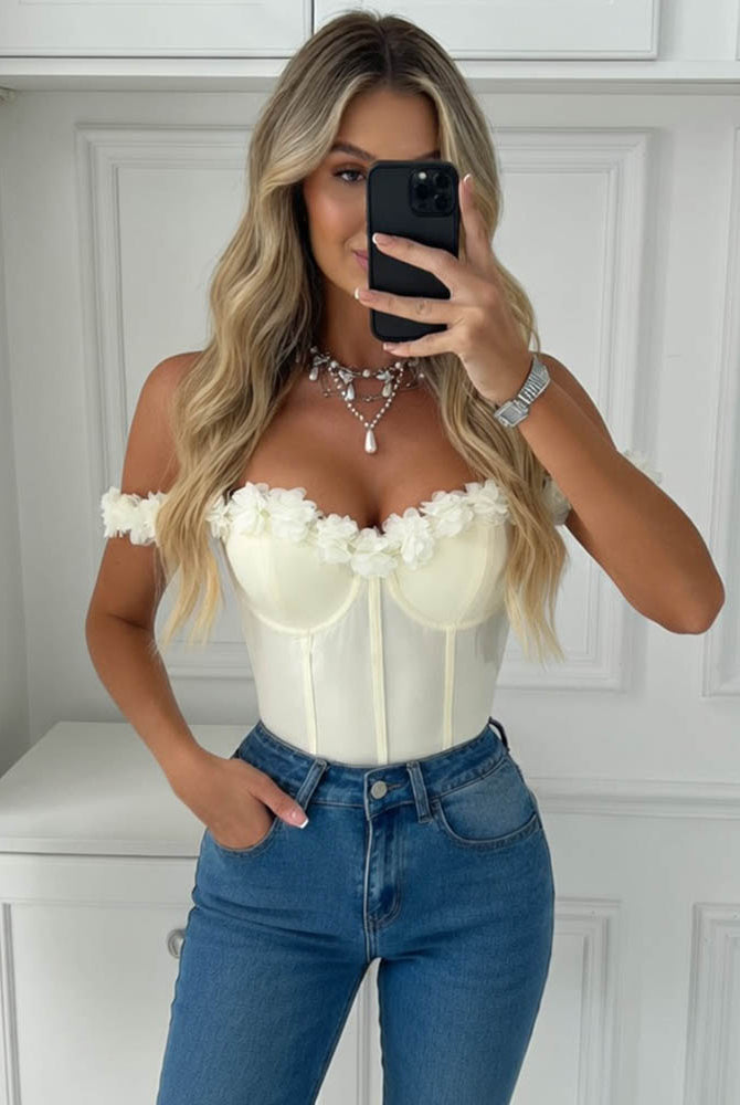 White off-shoulder corset bodysuit with floral ruffle shoulder details and sweetheart cups