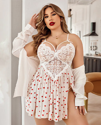 Plus-size model wearing a white lace babydoll with a heart-print skirt and a matching robe.