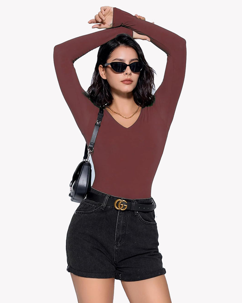 Burgundy V-neck long sleeve bodysuit. Confident and classy. Paired with black shorts and belt.