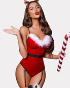 Festive red velvet bodysuit with fur trim and candy cane, set against a Christmas tree.