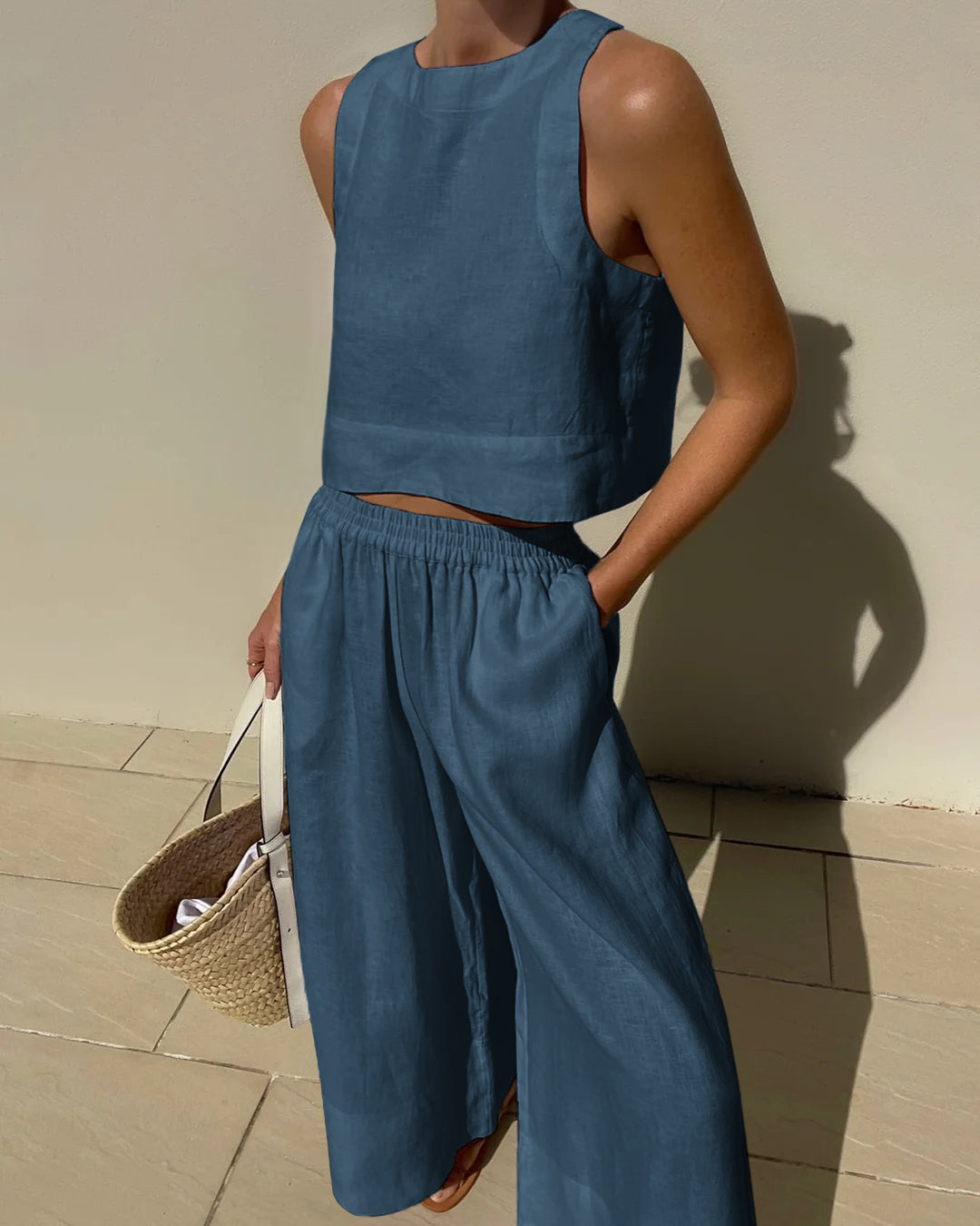 Blue linen crop top and wide leg pants set. Vacation style, breathable summer outfit.