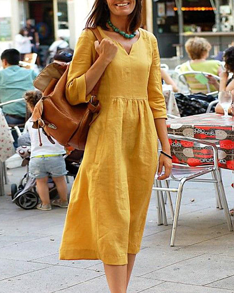 Yellow linen beach dress with V-neck and 3/4 sleeves, a perfect vacation style