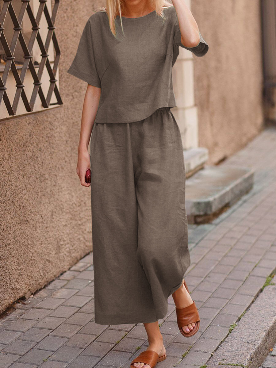 Olive green linen two-piece set, casual style. Loose fit top and wide leg pants for women.