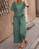 Teal green linen two-piece set for women. Comfortable loose fit top and wide leg pants.