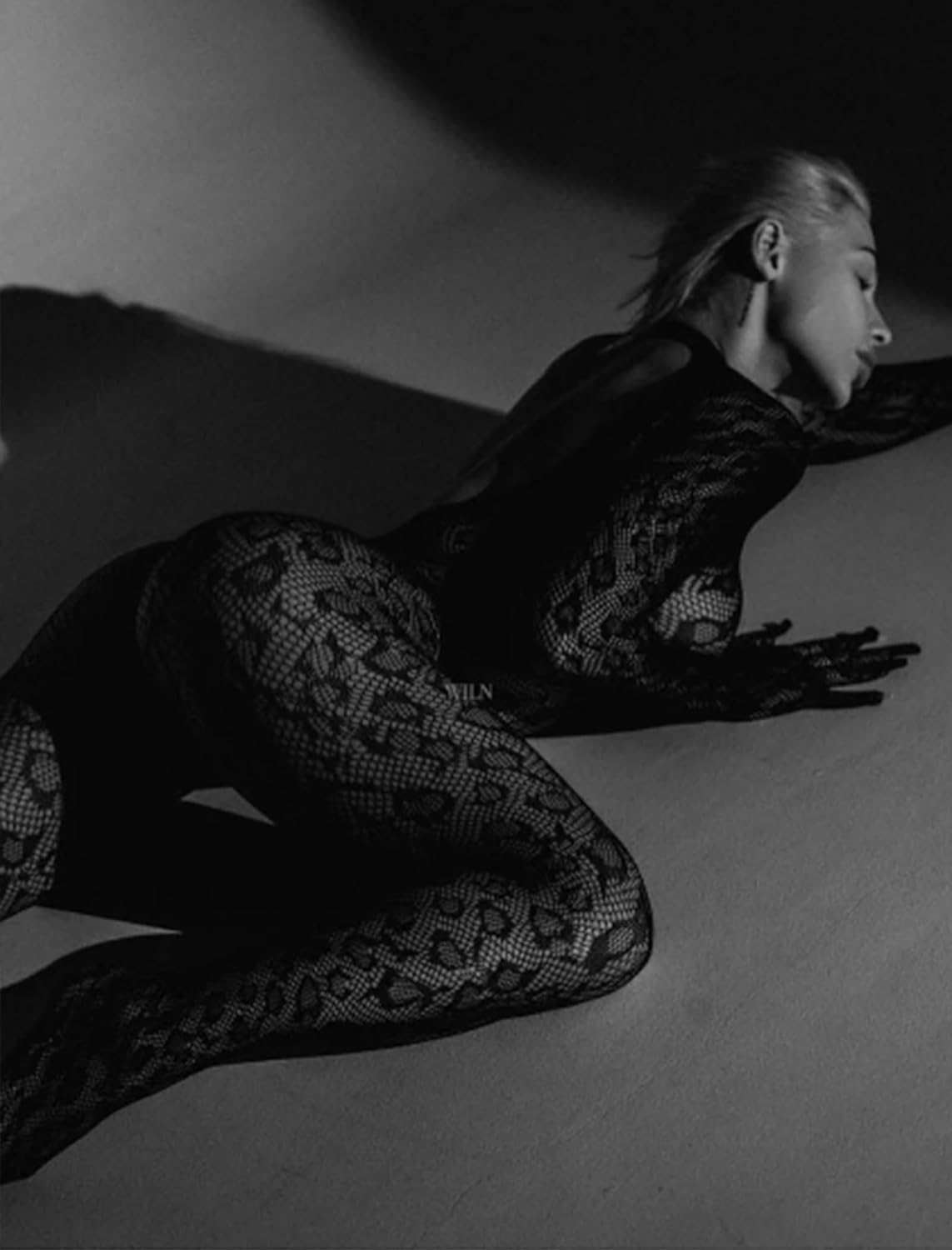 Fishnet bodysuit with snake-skin pattern for rave parties and date nights. Sexy lingerie.