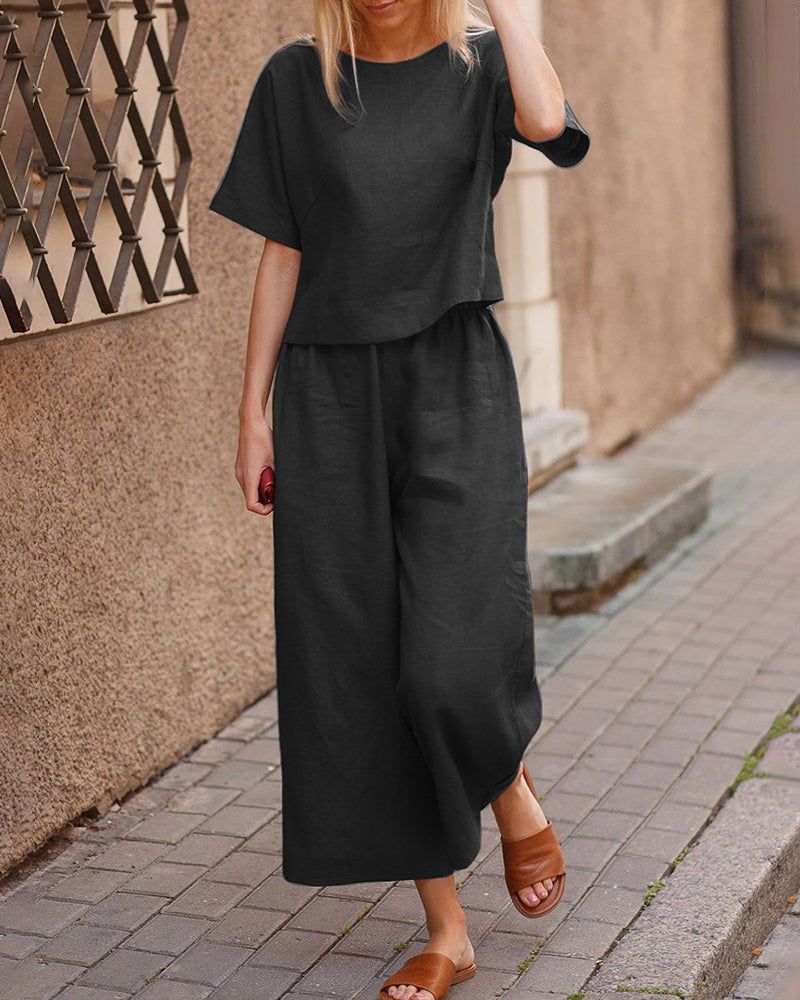 Black linen two-piece set, casual style. Loose fit top and wide leg pants for women.