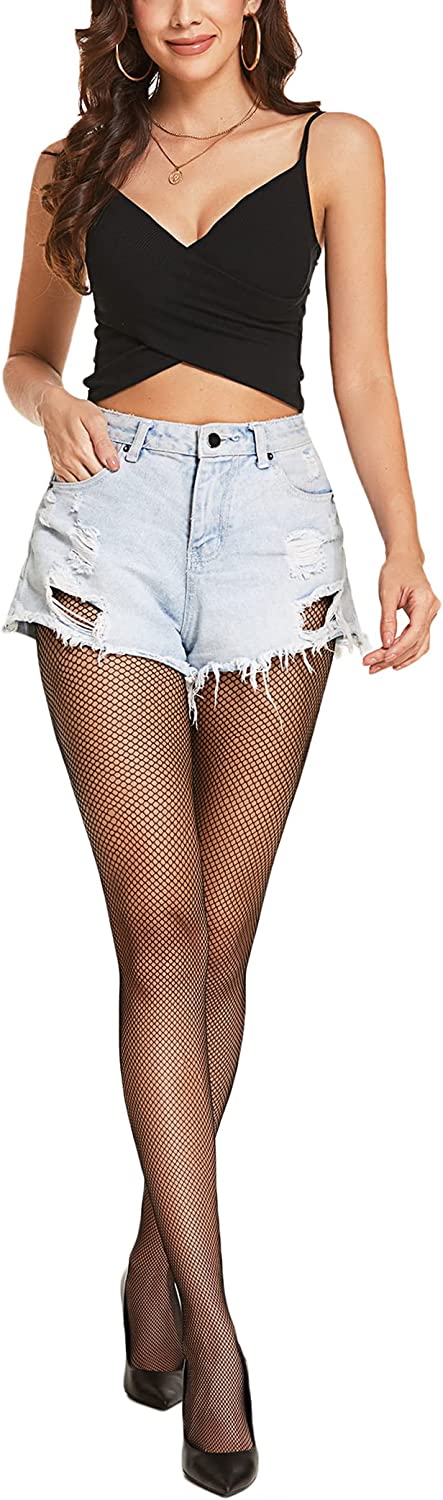 Woman in black fishnet stockings and shorts. Confident and sexy look. Avidlove plus size lingerie.