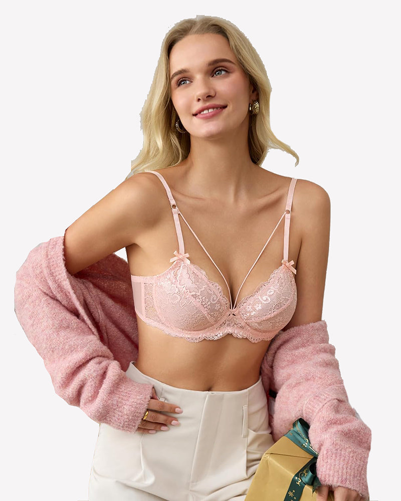 Pink lace strappy bra with underwire support and bow accents. Sexy lingerie for women.