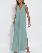 Soft green sleeveless maxi dress with V-neck, floor-length, and side slits for elegant style.