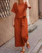 Burnt orange loose fit two piece set made of linen-like material. Comfortable and stylish outfit.