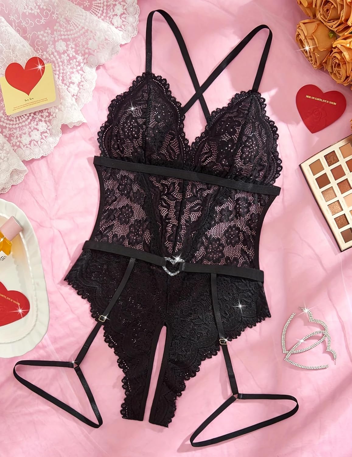 Black lace crotchless bodysuit with garter belt, sexy lingerie design.