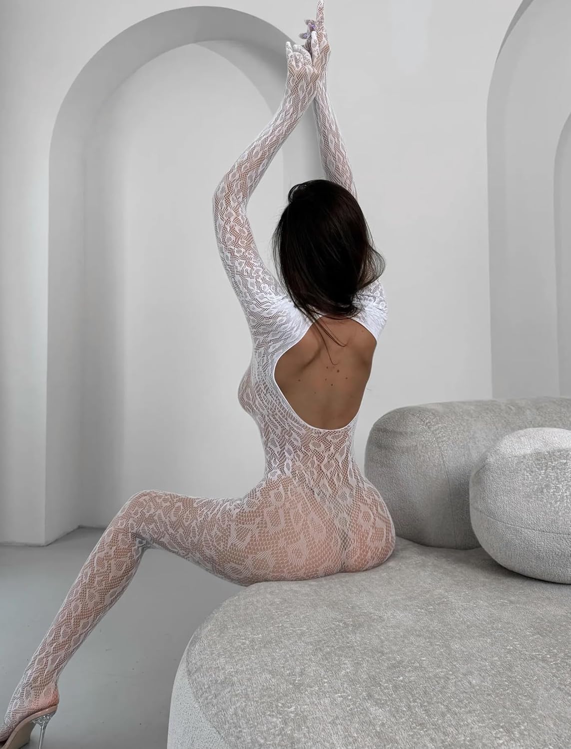 White fishnet bodysuit with snake-skin pattern. Sexy rave lingerie with long sleeves and open back.
