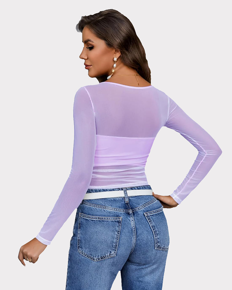 Lavender mesh asymmetrical crop top with long sleeves and jeans. Sheer, stylish top by Avidlove.