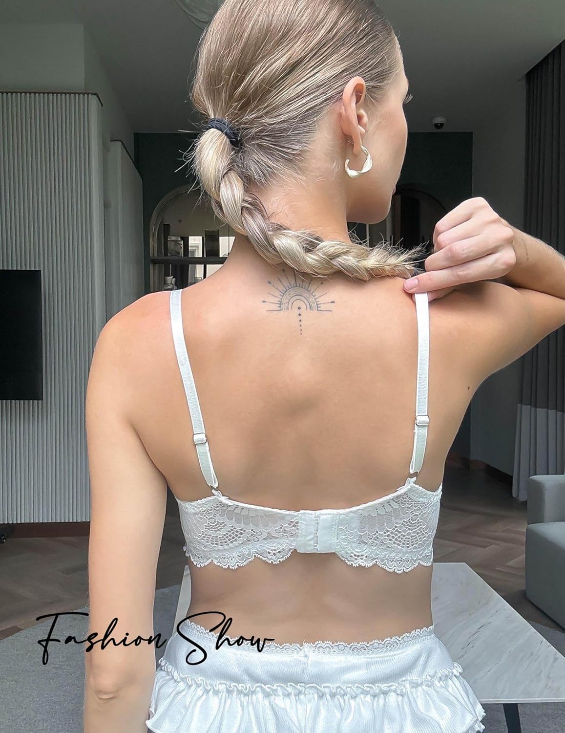 White lace underwire bra with scalloped trim, Fashion Show lingerie, back view.