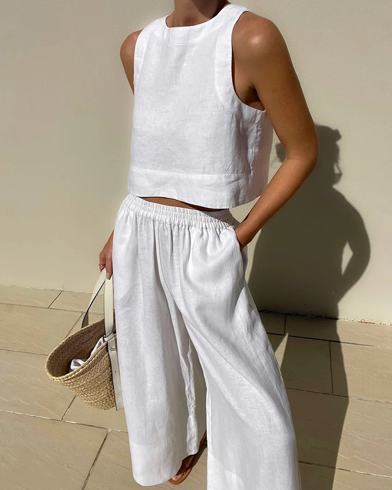 White linen crop top and wide leg pants set. Vacation style, perfect for summer days.