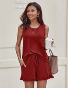 Red sleeveless loungewear top and matching ruffle hem shorts set