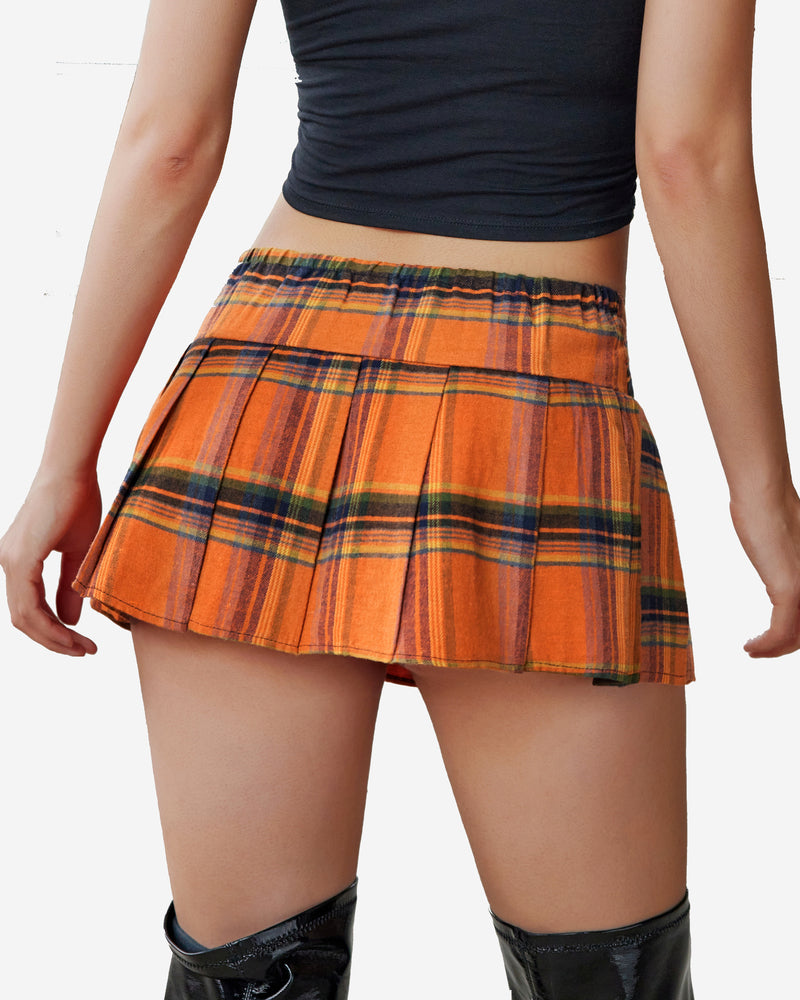 Orange plaid mini skirt with pleats. Comfortable and stylish skirt for women.