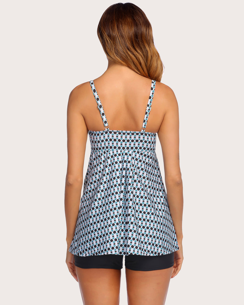 Women's tankini swimsuit set: patterned top with adjustable straps and black swim shorts.