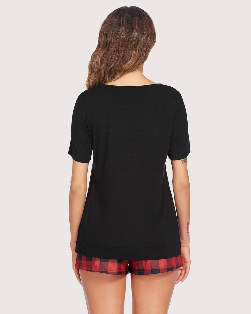 Women's black top and red plaid shorts pajama set. Soft rayon sleepwear for casual comfort.