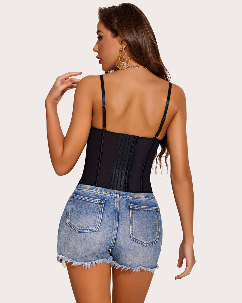 Black lace bustier corset top with adjustable straps and denim shorts. Perfect for a night out.