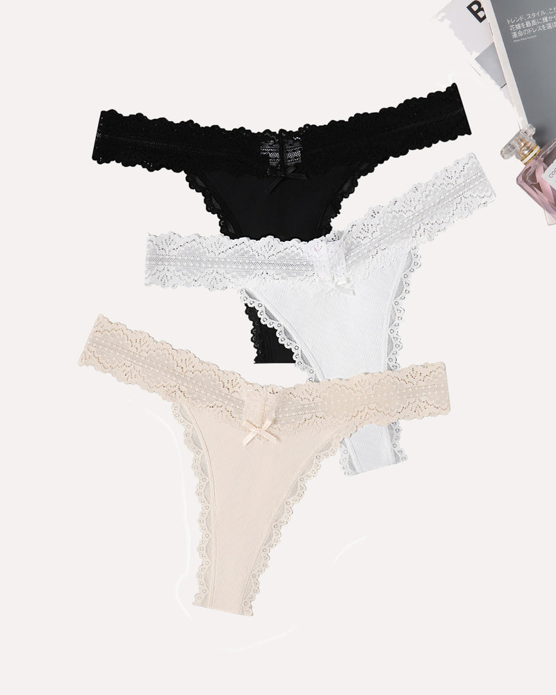 Avidlove thong panties set. Black, white, and beige with lace waist, ribbed fabric and bow.