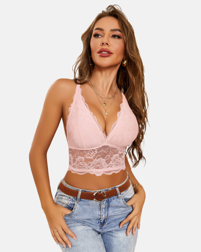 Pink lace racerback crop top bra with V-neck on a woman in jeans. Avidlove lingerie style.