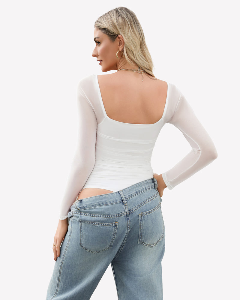White mesh square neck bodysuit with ruched detail, long sleeves, model in jeans and gold jewelry.