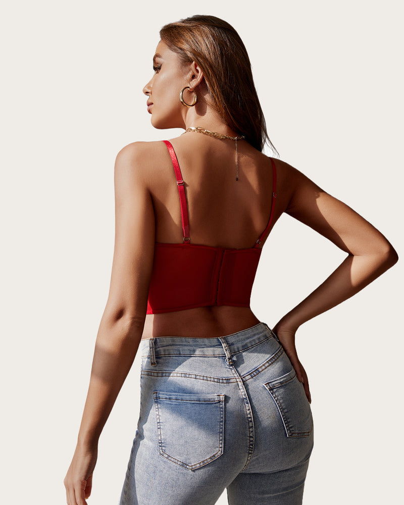 Red underwired racerback crop top with adjustable straps on a woman; lingerie with blue jeans.