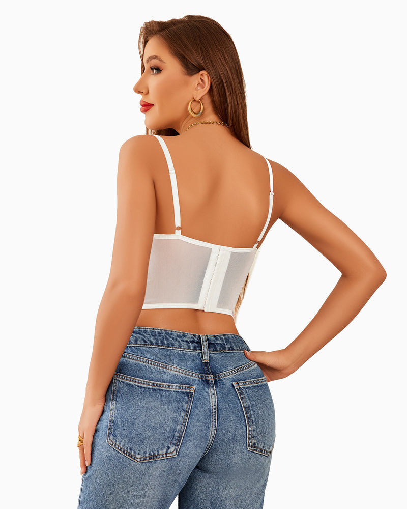 White corset top with adjustable straps, paired with blue jeans. Perfect club attire from Avidlove.