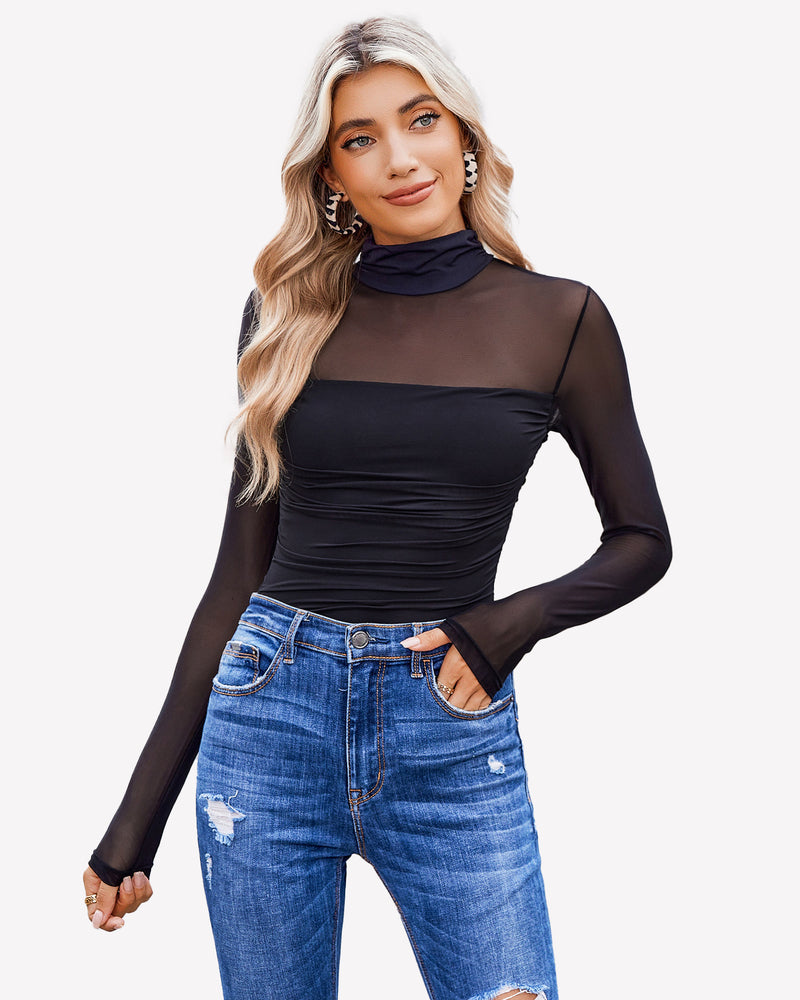 Black turtle neck bodysuit with mesh sleeves and blue denim jeans. Going out outfits for women.